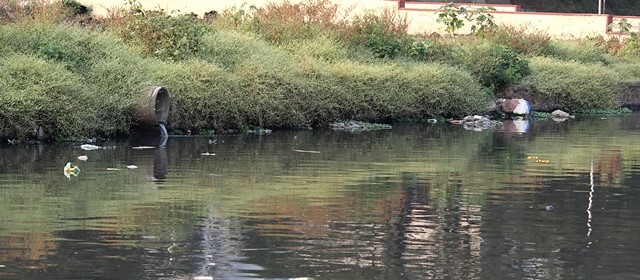 Sewage being deposited into the river water in the city (Image Source: India Water Portal)
