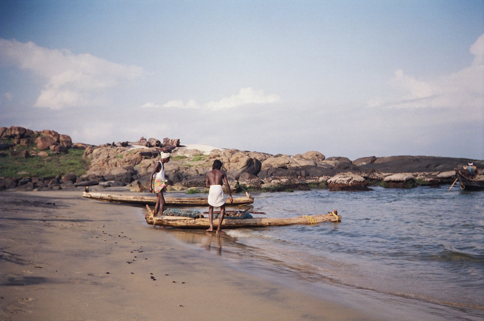 A fisherman with his traditional boat