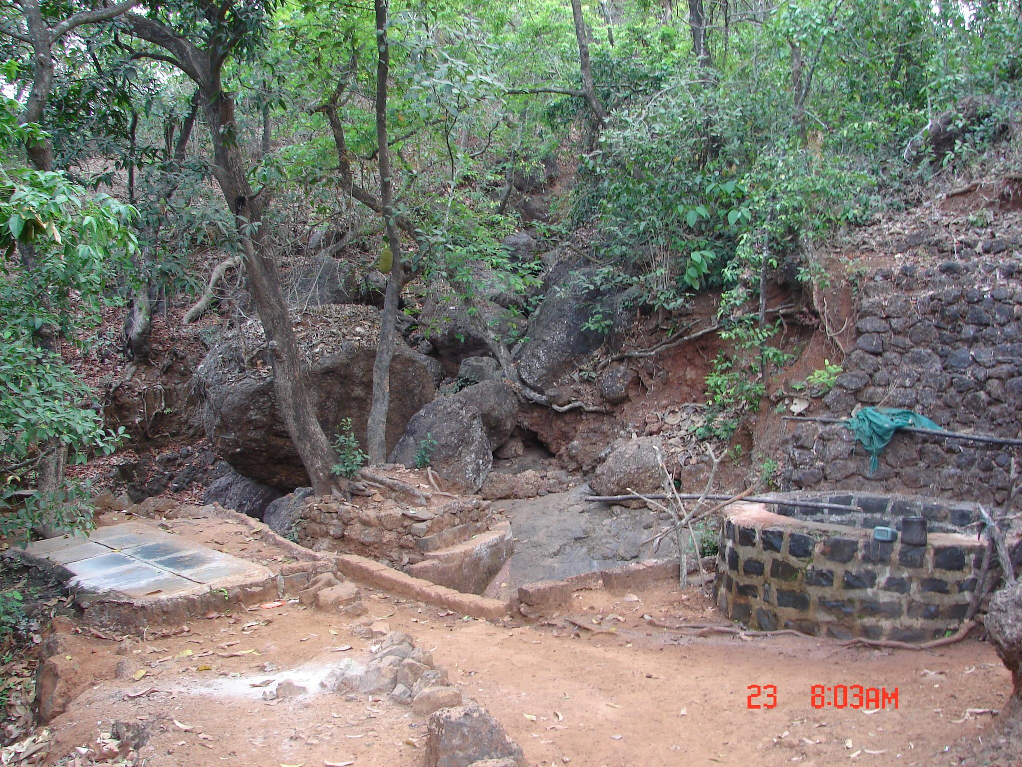 A springwater collection system at Kolhe Waadi in summer. The shallow well contains clean drinking water.