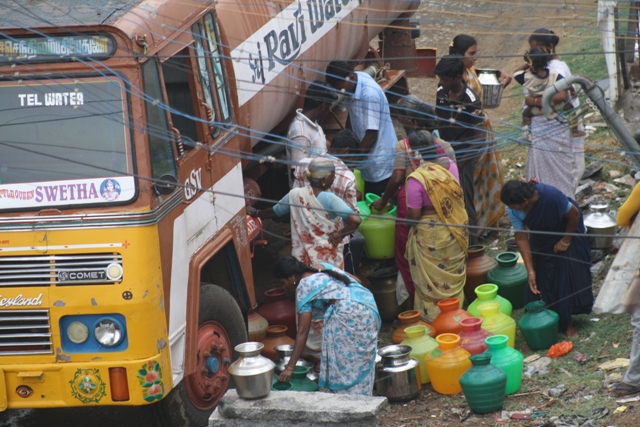 Women collecting water from a tanker in Vellore