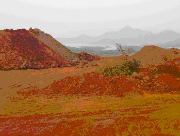 Mounts of mining waste, with Selaulim reservoir in the background. Photo: Ramesh Gauns