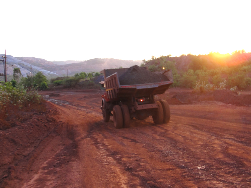 Dumper carrying iron ore from the mines. The use of heavy vehicles in the mines and within city  limits has badly affected the roads in the area.