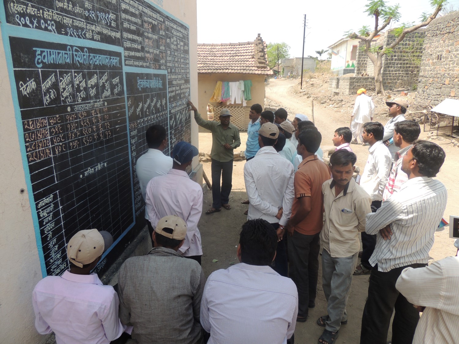 A Jal Sevak, explaining the concept of village level water budgeting to the Kumbharwadi villagers (Image: WOTR)