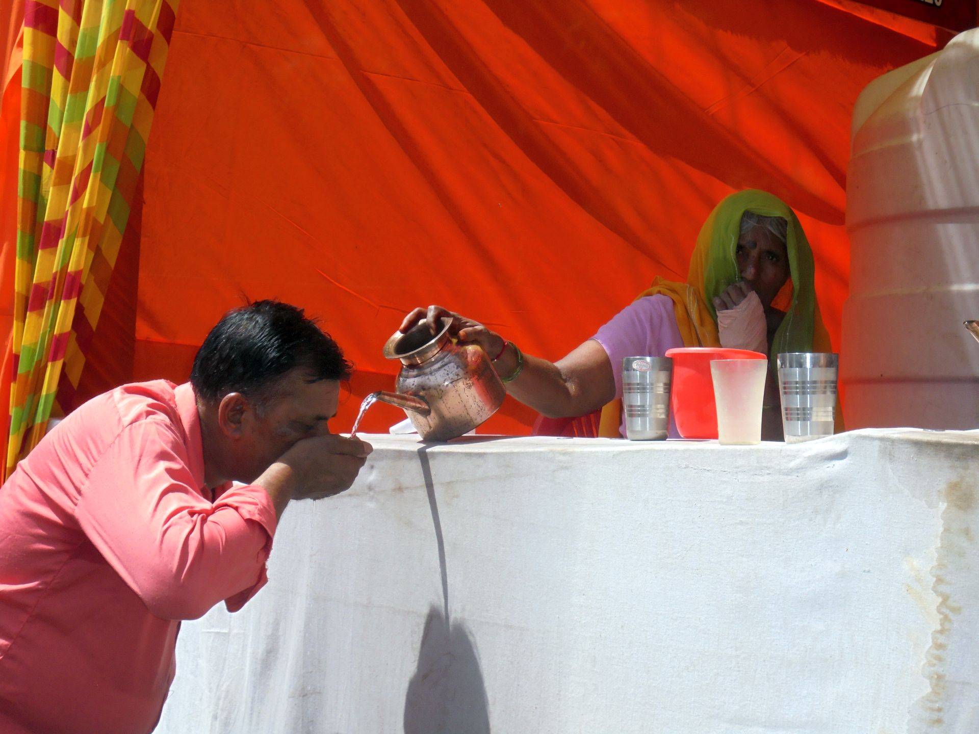 Public drinking water points, locally known as piaos, provide respite to people as the city faces scorching summer heat.