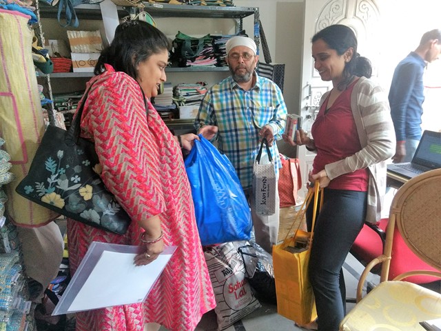 Pune resident Ritu, with a bagful of household plastic waste, interacts with Amita.