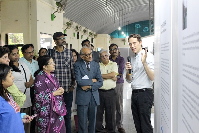 Dr Anthony interacts with the visitors at the exhibition. (Image source: Columbia Global Centers, Mumbai)