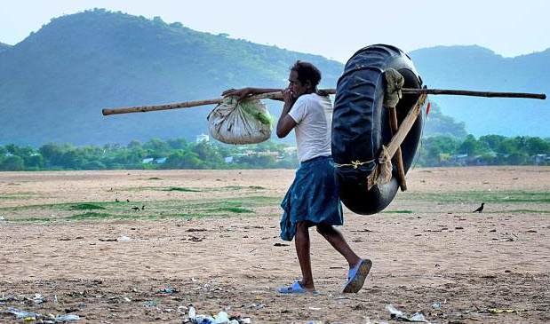 Desolate Fishermen across a dry Krishna in Andhra Pradesh. Photo: The Hindu