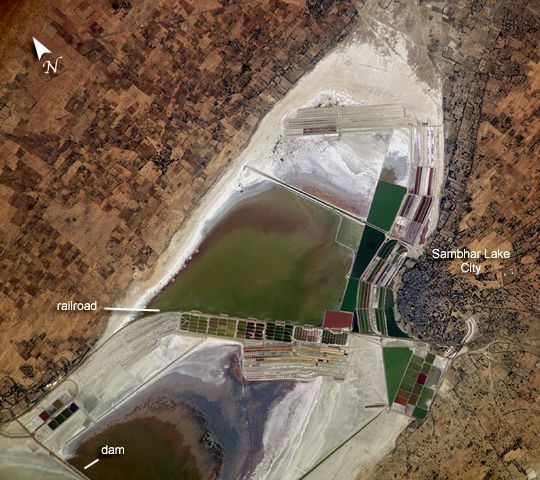 This image, taken by astronauts aboard the International Space Station, shows the Sambhar lake’s eastern salt works in detail. The elliptical lake occupies an area of 190 to 230 square kilometers based on the season. It has a length of approximately 35.5 km and a breadth varying between 3 km and 11 km.