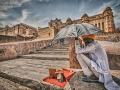A man sits under the scorching heat of the sun in front of Amer fort in Jaipur (Picture courtesy: Prabhu B Doss, Flickr Commons: CC-By-NC-ND-2.0)