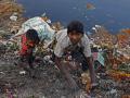 Children rummage through garbage near the Yamuna river. (Source: IWP Flickr Photo)
