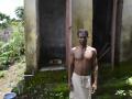 Anup Munda showing his functional toilet at Bandha Bhuin