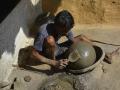 A potter making a clay pot in Jevra Sirsa village in Durg district