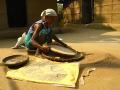 Jhum farmer sifting rice