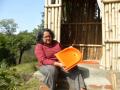 Chicu with a pan used in ecosan toilet. (Photo courtesy: Chicu Lokgariwar)