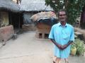 Renupada Bagdi in front of his thatched house. (Photo: Gurvinder Singh)