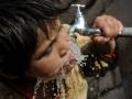 Child drinks water from a tap (Image: Imal Hashemi/Taimani Films/World Bank, Flickr Commons, CC BY-NC-ND 2.0)