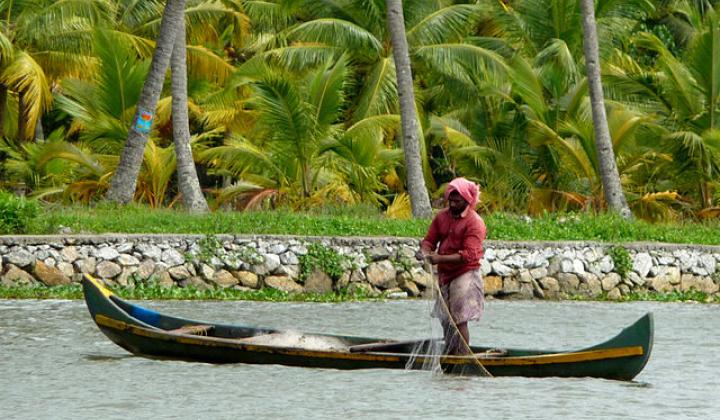 Fishing in an irrigation canal in Kerala (Image Source: Martin Pilkinton via Wikimedia Commons)