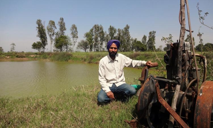 Harmesh Singh has taken to rainwater harvesting on his farm since the groundwater has gone down.