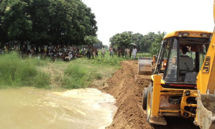 Earthmovers carrying out irrigation project works
