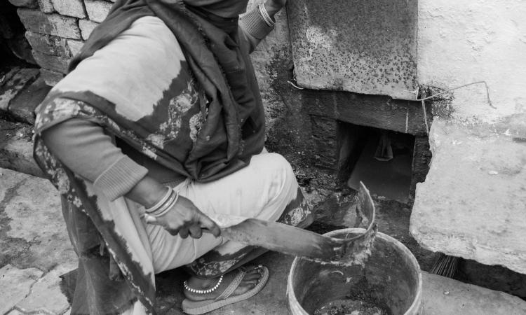 A manual scavenger at work (Image source: CS Sharada Prasad and Isha Ray)