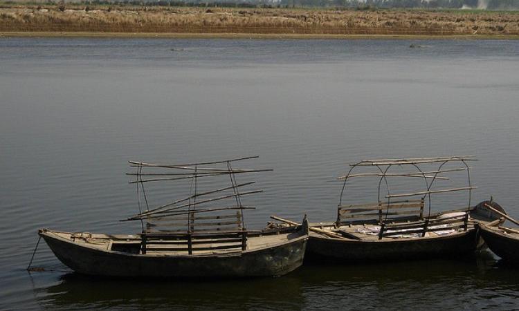 Navigating rivers through simple boats. (Source: IWP Flickr Photos)