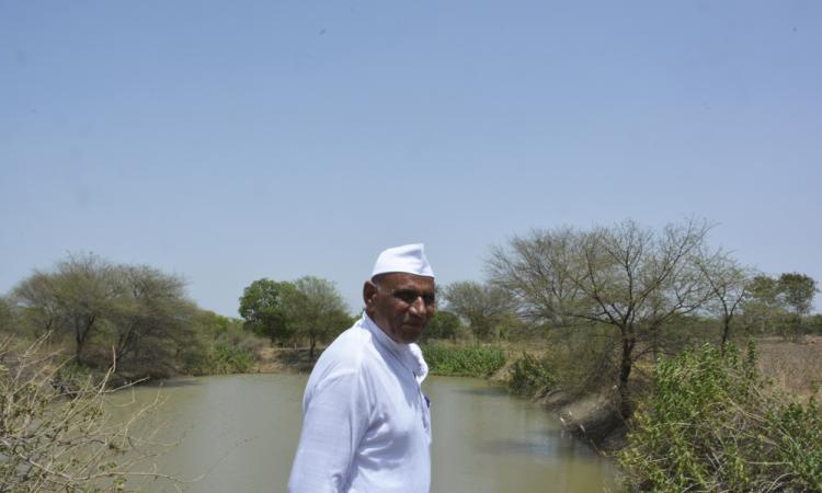 Vikram Patel near his farm pond in Chidavad.