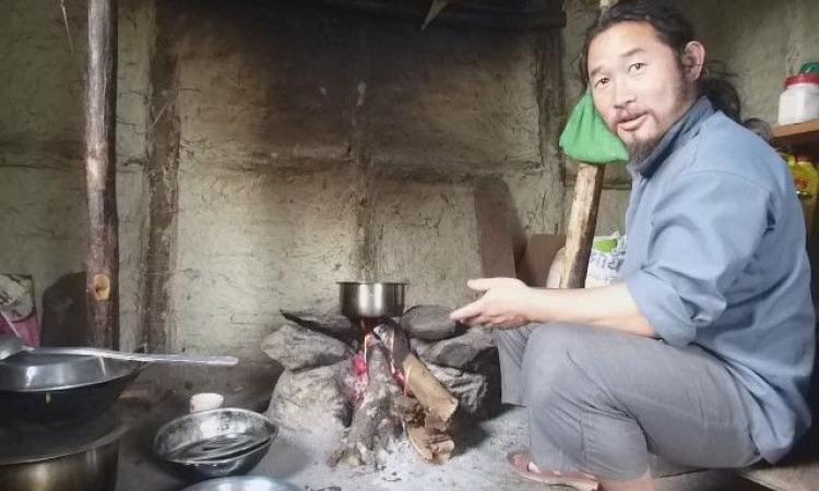 Tenzing Lepcha sits at the hearth of his farmstay. (Pic courtesy: Chicu)