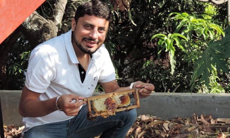 Amit with a bee box installed in a garden at a house in Pune. (Image source: Amit Godse)