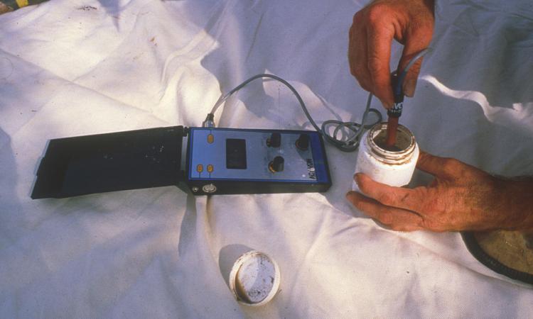 The electrical conductivity of a diluted soil sample is being tested as a measure of soil salinity. (Image:CSIRO, Wikimedia Commons; CC Attribution 3.0 Unported)