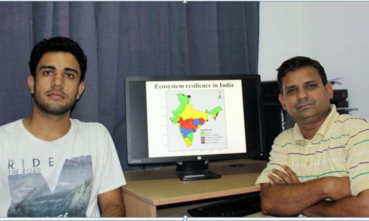 Dr Manish Goyal (right) and Ashutosh Sharma with the ecosystem resilience map they developed.