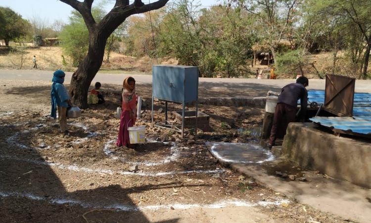 People were following social distancing in villages while collecting water (Image: INREM)