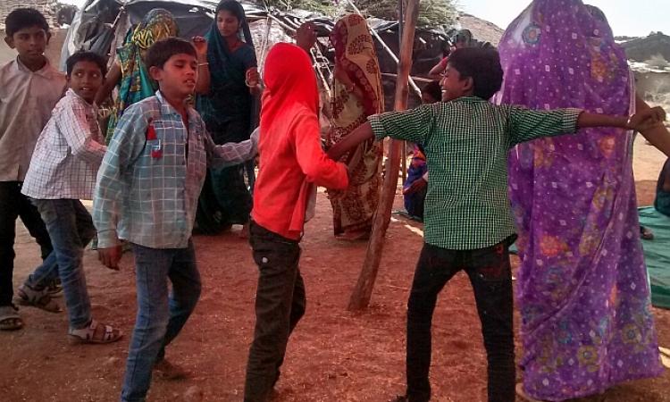 Children dance during the inaugration of the safe water supply system in Kalapani, Madhya Pradesh