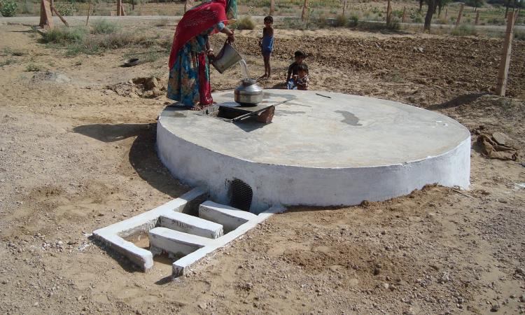 A woman draws water from a 'taanka' in Rajasthan (Source: Wikipedia)