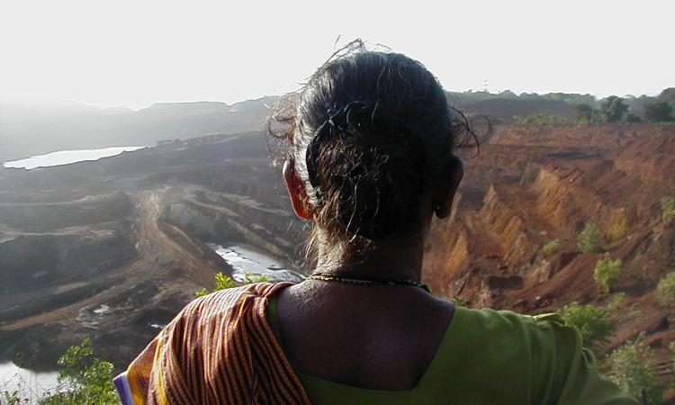 Villager looking at mining devastated areas in Goa (Image: Frederik Noronha; Wikimedia Commons; CC A-S A 4.0 International)