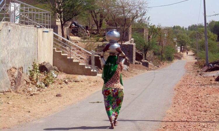 Women are burdened with household tasks such as collecting water. (Image Source: India Water Portal)