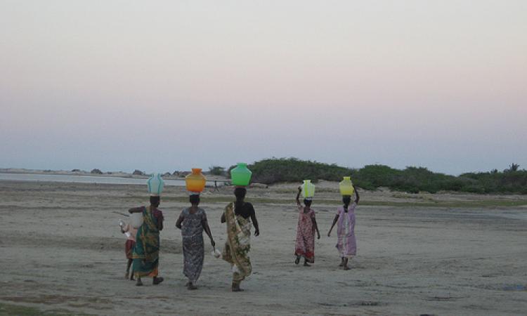 Women walk long distances to fetch water 